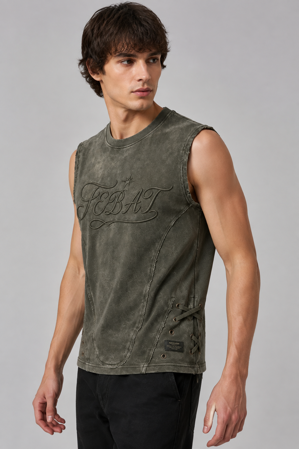 Adult model wearing the FEBAT distressed lace-up sleeveless top, three-quarter studio view