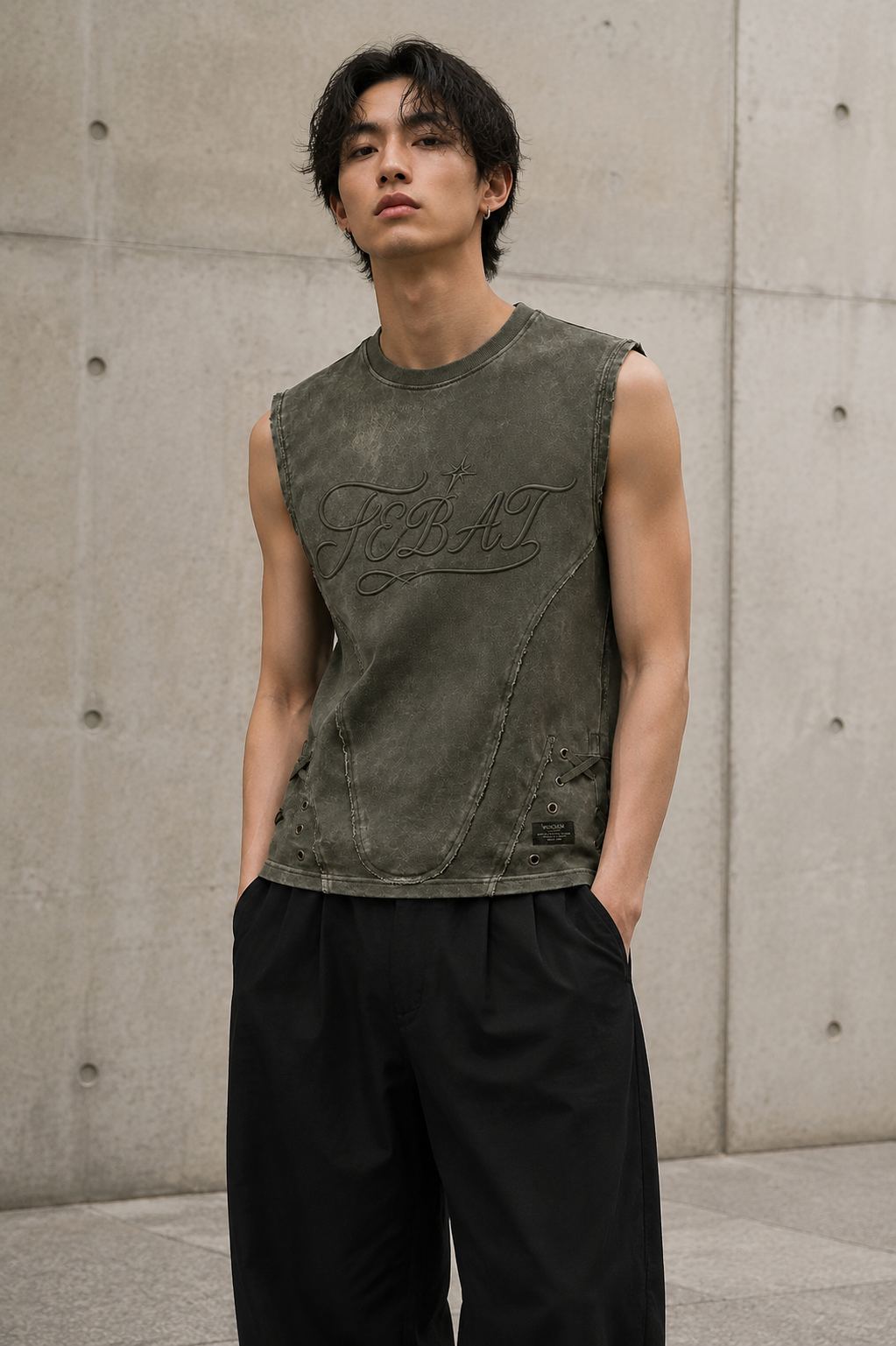 Adult model wearing the FEBAT distressed lace-up sleeveless top in an urban setting